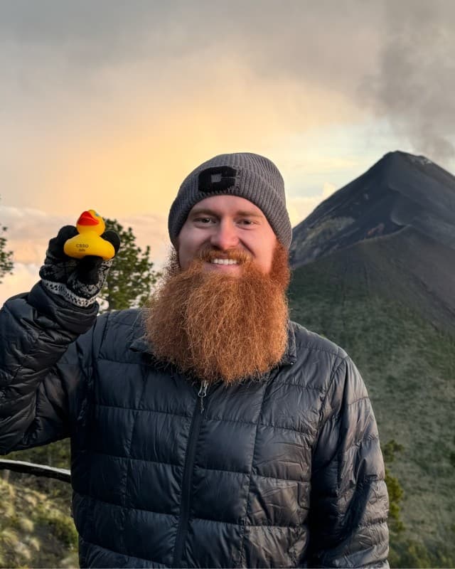 Thomas Scott Meade II outdoors, wearing a travel jacket